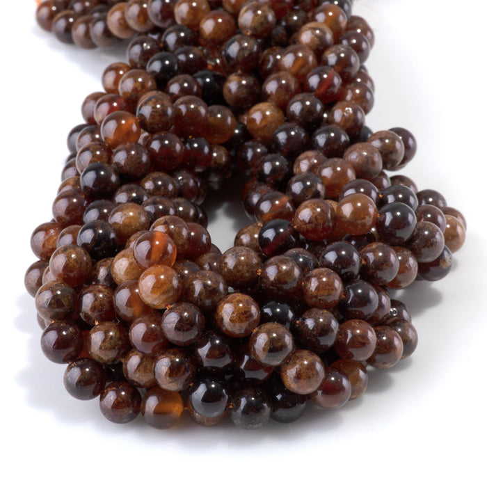 This is a Dakota Stones 8mm Orange Garnet Gemstone strand with round beads in 15-16 inch strand.