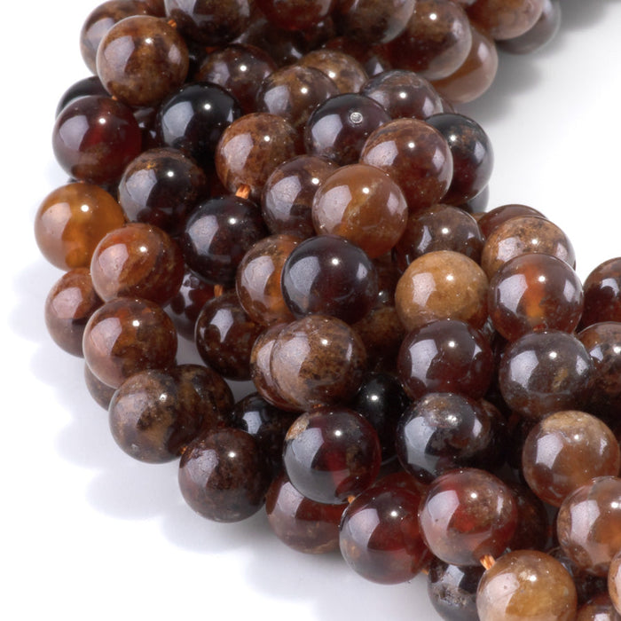 This is a Dakota Stones 8mm Orange Garnet Gemstone strand with round beads in 15-16 inch strand.