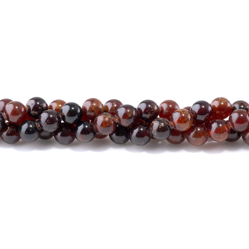 This is a Dakota Stones 8mm Orange Garnet Gemstone strand with round beads in 8 inch strand.