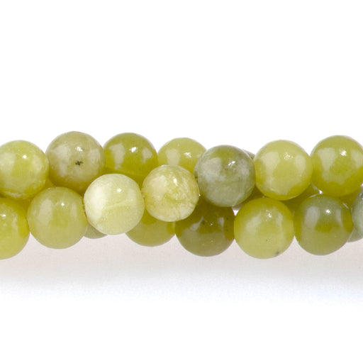 This is a Dakota Stones 4mm Olive Jade Gemstone strand with round beads in 15-16 inch strand.