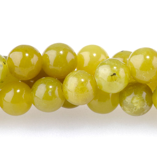 This is a Dakota Stones 6mm Olive Jade Gemstone strand with round beads in 15-16 inch strand.