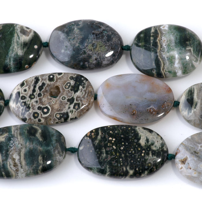 This is a Dakota Stones 18x28-20x30mm Ocean Jasper Gemstone strand with A grade oval beads in 15-16 inch strand.