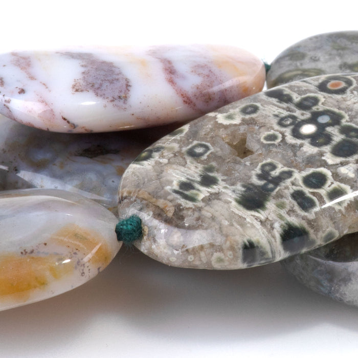 This is a Dakota Stones 18x28-20x30mm Ocean Jasper Gemstone strand with A grade oval beads in 15-16 inch strand.