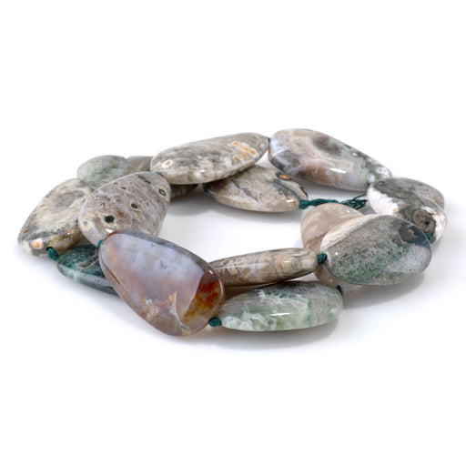 This is a Dakota Stones 18x25-20x30mm Ocean Jasper Pear Gemstone strand of round beads in 15-16 inch strand.