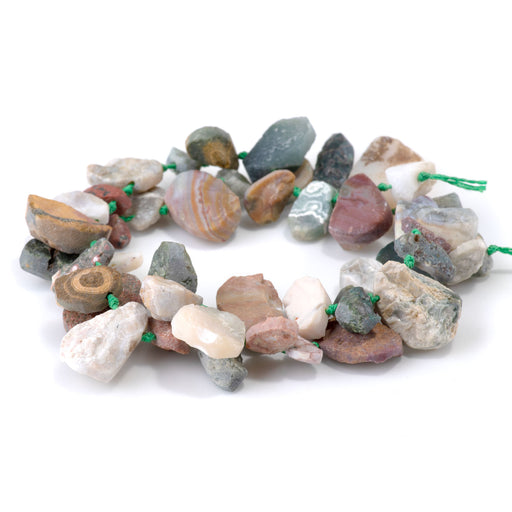 This is a Dakota Stones 8x12-13x18mm Ocean Jasper Top Drill Pear Gemstone strand with rough beads in 15-16 inch strand.
