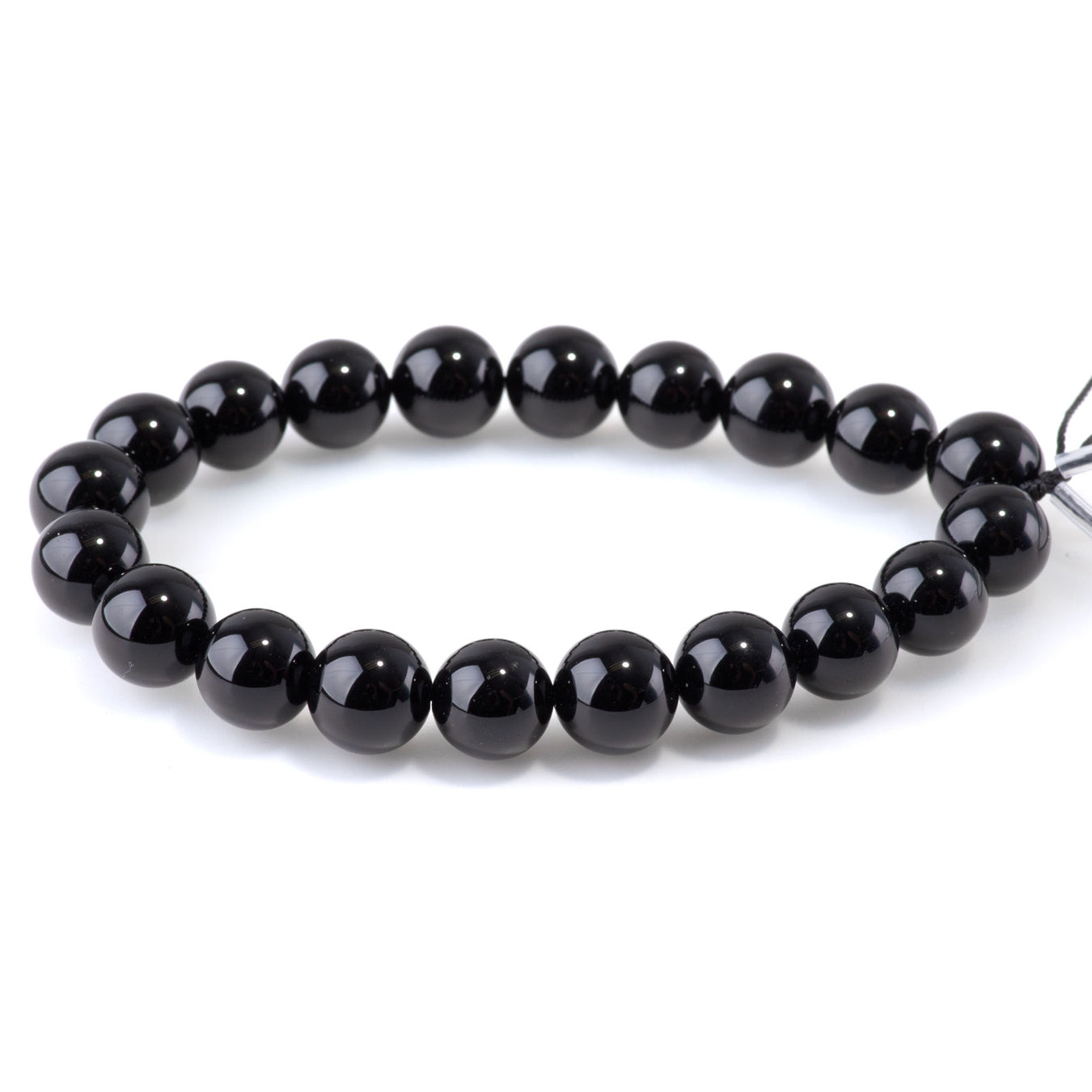 This is a Dakota Stones 10mm Onyx Gemstone strand with round beads in 8 inch strand.