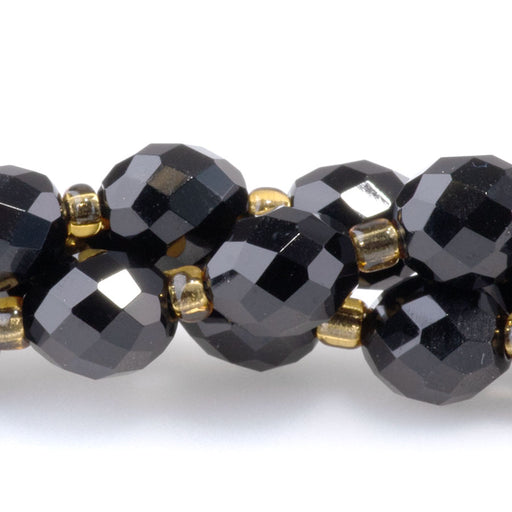 This is a Dakota Stones 7x8mm Onyx Egg Gemstone strand with faceted beads in 15-16 inch strand.