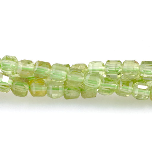 This is a Dakota Stones 3mm Peridot Gemstone strand with A grade table-cut cube beads in 15-16 inch strand.