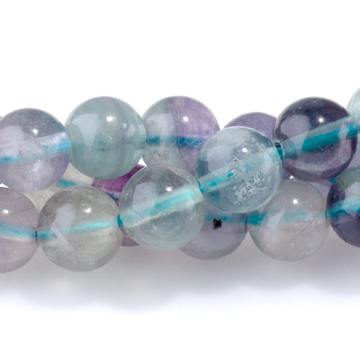 This is a Dakota Stones 6mm Purple Fluorite Gemstone strand with round beads in 15-16 inch strand.