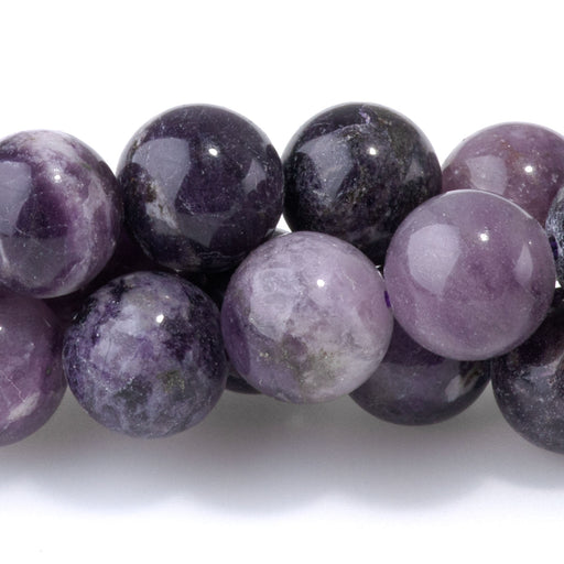 This is a Dakota Stones 8mm Purple Fluorite Gemstone strand with A grade round beads in 15-16 inch strand.