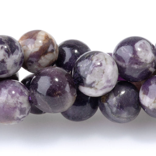 This is a Dakota Stones 8mm Purple Flower Fluorite Gemstone strand with A grade round beads in 15-16 inch strand.