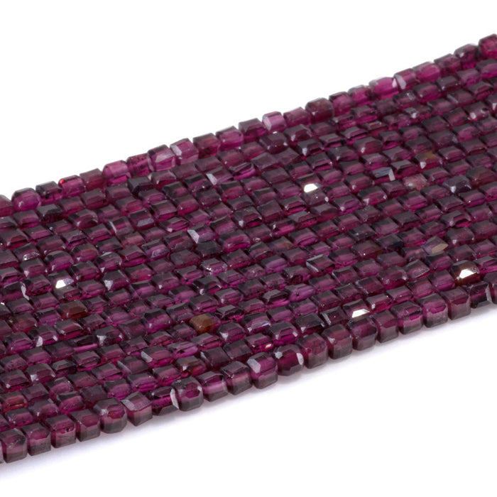 This is a Dakota Stones 3mm Purple Garnet Gemstone strand with A grade table-cut cube beads in 15-16 inch strand.