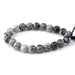 This is a Dakota Stones 10mm Black Picasso Jasper Large Hole Gemstone strand with round beads in 8 inch strand.
