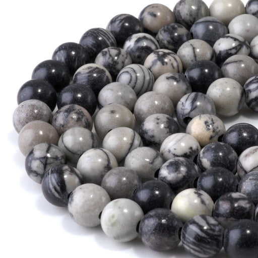 This is a Dakota Stones 10mm Black Picasso Jasper Large Hole Gemstone strand with round beads in 8 inch strand.