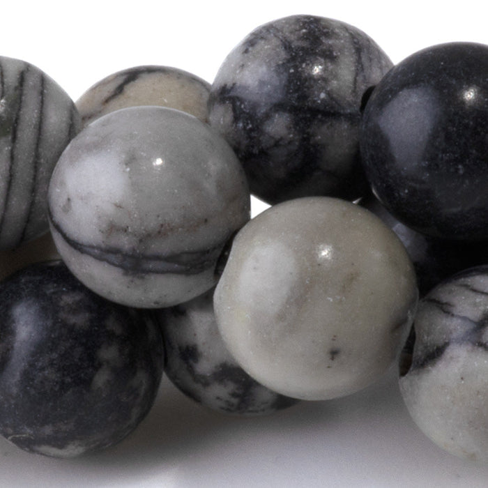 This is a Dakota Stones 10mm Black Picasso Jasper Large Hole Gemstone strand with round beads in 8 inch strand.