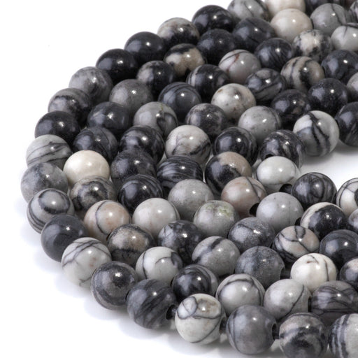 This is a Dakota Stones 8mm Black Picasso Jasper Large Hole Gemstone strand with round beads in 8 inch strand.