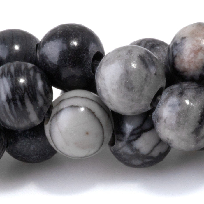 This is a Dakota Stones 8mm Black Picasso Jasper Large Hole Gemstone strand with round beads in 8 inch strand.