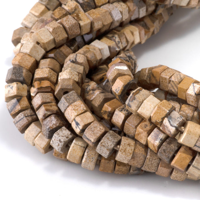 This is a Dakota Stones 6mm Picture Jasper Large Hole Gemstone strand with faceted hexagon beads in 8 inch strand.