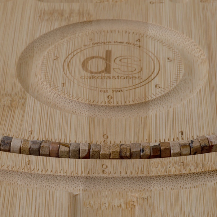 This is a Dakota Stones 6mm Picture Jasper Large Hole Gemstone strand with faceted hexagon beads in 8 inch strand.