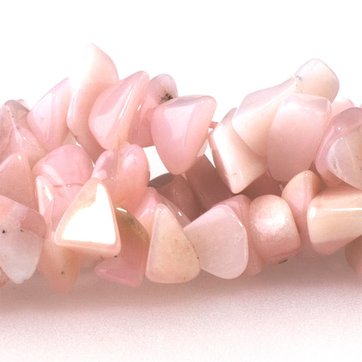 This is a Dakota Stones 3x6-5x7mm Pink Opal Gemstone strand with chip beads in 15-16 inch strand.