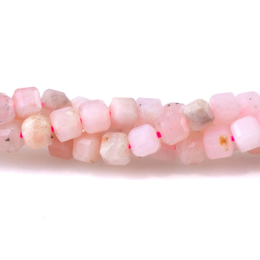 This is a Dakota Stones 3mm Pink Opal Gemstone strand with A grade table-cut cube beads in 15-16 inch strand.