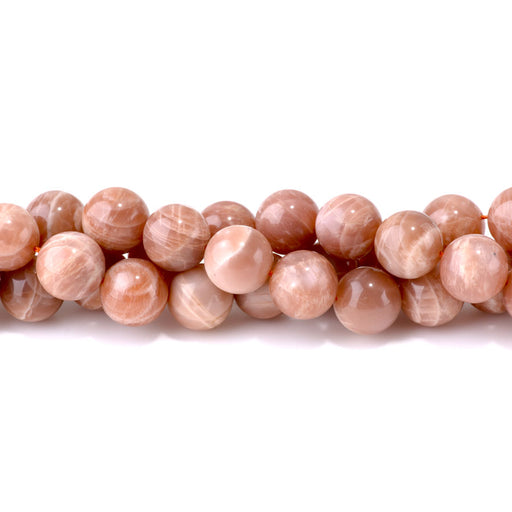 This is a Dakota Stones 14mm Peach Moonstone Gemstone strand with round beads in 15-16 inch strand.