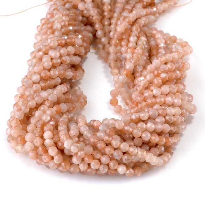 This is a Dakota Stones 4mm Peach Moonstone Gemstone strand with AA grade faceted round beads in 15-16 inch strand.