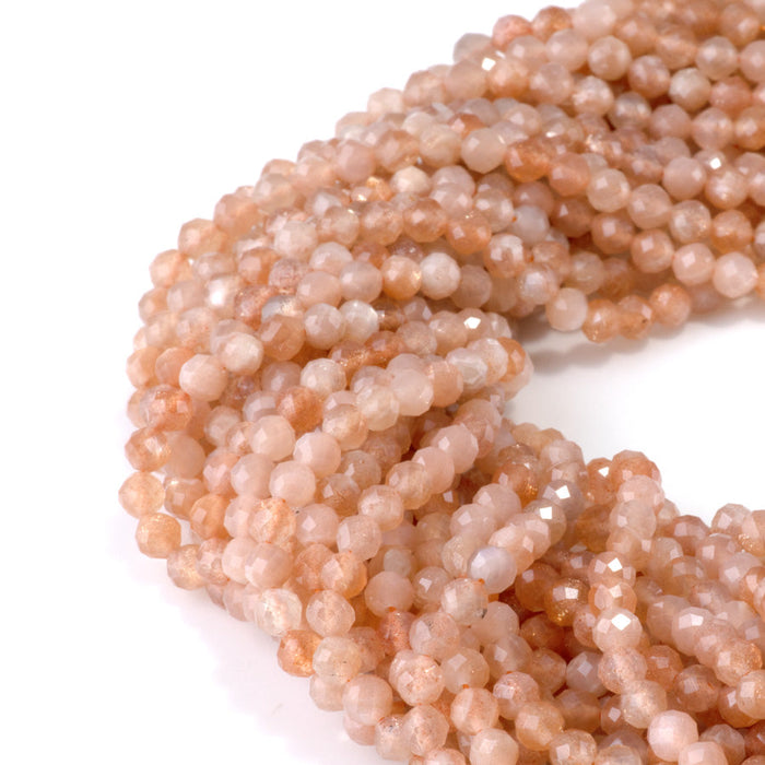 This is a Dakota Stones 4mm Peach Moonstone Gemstone strand with AA grade faceted round beads in 15-16 inch strand.
