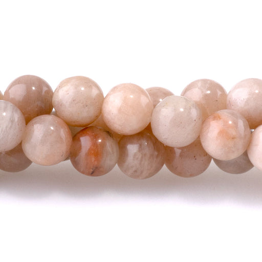 This is a Dakota Stones 6mm Peach Moonstone Gemstone strand with round beads in 15-16 inch strand.