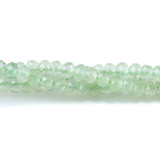 This is a Dakota Stones 3mm Prehnite Gemstone strand with A grade faceted rondelle beads in 15-16 inch strand.