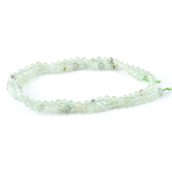 This is a Dakota Stones 4mm Prehnite Bicone Gemstone strand with faceted beads in 15-16 inch strand.