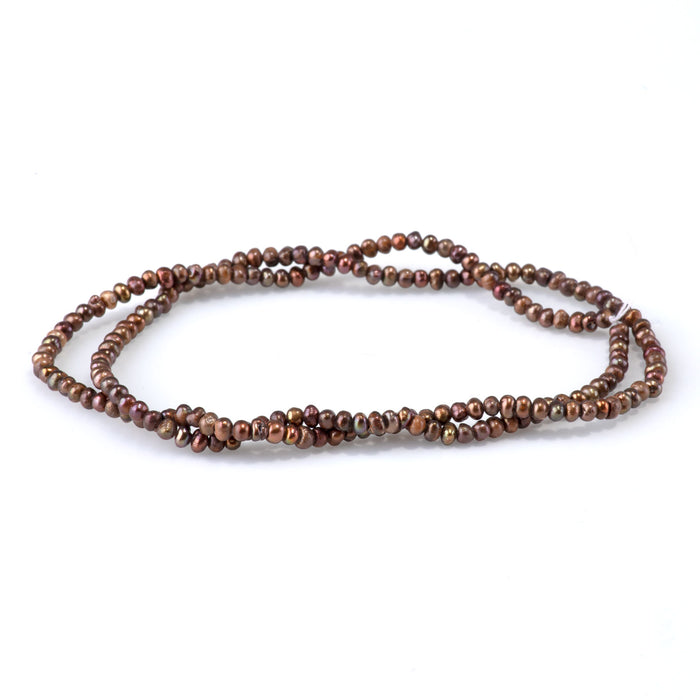 This is a Dakota Stones 5-3mm Freshwater Pearl Brown Potato Gemstone strand of round beads in 15-16 inch strand.