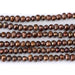 This is a Dakota Stones 5-3mm Freshwater Pearl Brown Potato Gemstone strand of round beads in 15-16 inch strand.
