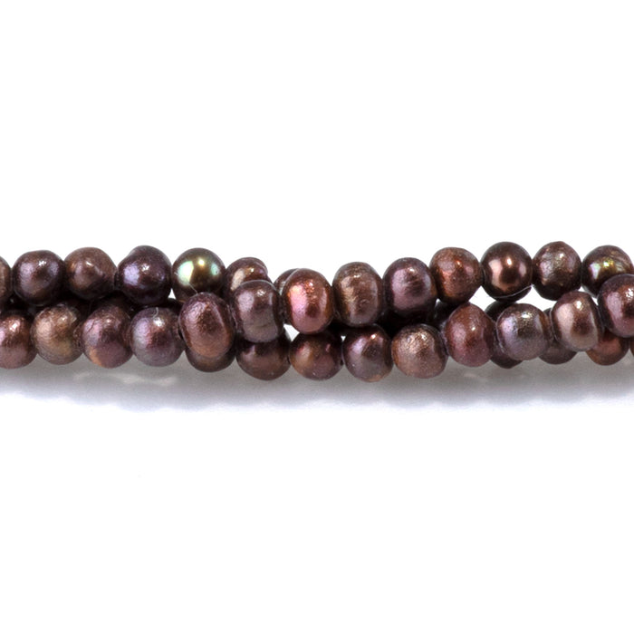 This is a Dakota Stones 5-3mm Freshwater Pearl Dark Brown Potato Gemstone strand of round beads in 15-16 inch strand.