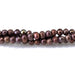 This is a Dakota Stones 5-3mm Freshwater Pearl Dark Brown Potato Gemstone strand of round beads in 15-16 inch strand.