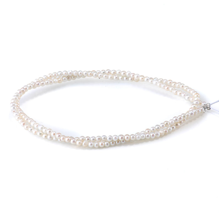 This is a Dakota Stones 5-3mm Freshwater Pearl White Potato Gemstone strand of round beads in 15-16 inch strand.