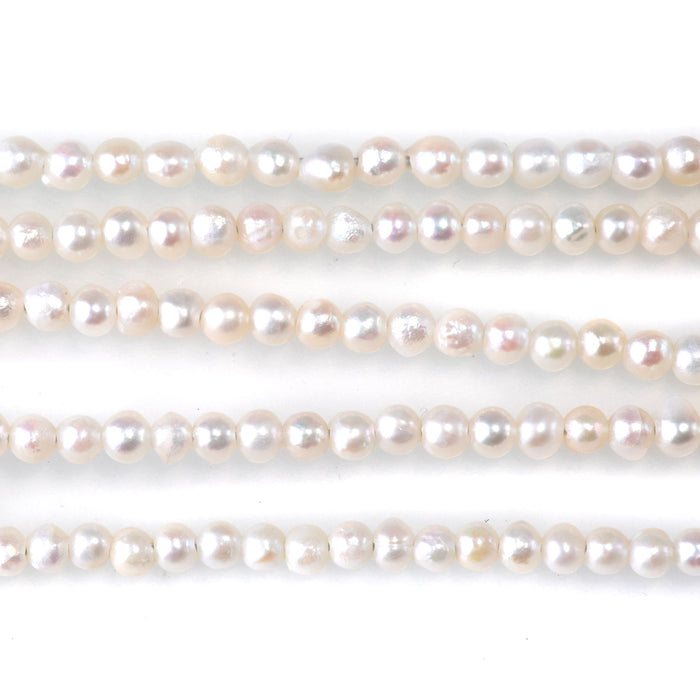 This is a Dakota Stones 5-3mm Freshwater Pearl White Potato Gemstone strand of round beads in 15-16 inch strand.