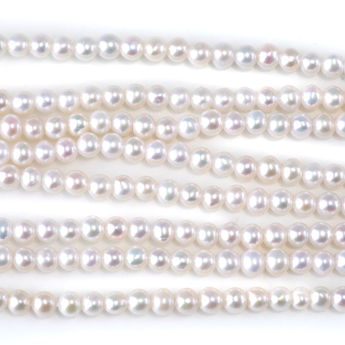 This is a Dakota Stones 4-5mm Freshwater Pearl White Potato Large Gemstone strand of round beads in 8 inch strand.