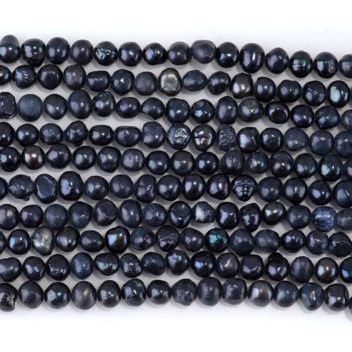 This is a Dakota Stones 4mm Freshwater Pearl Black Semi Gemstone strand with round beads in 15-16 inch strand.