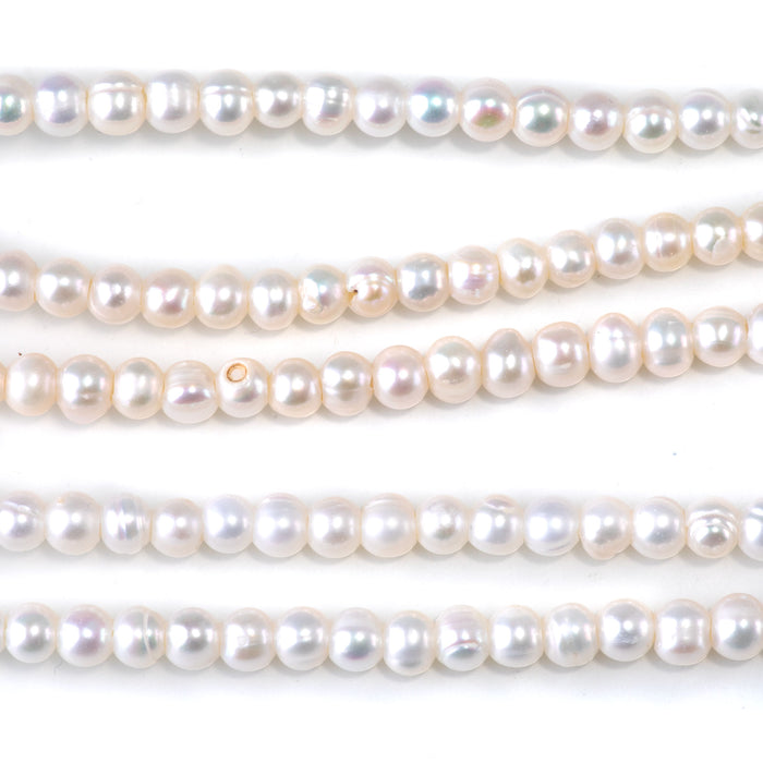 This is a Dakota Stones 5-6mm Freshwater Pearl White Potato Large Gemstone strand of round beads in 8 inch strand.