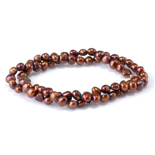 This is a Dakota Stones 5-7mm Special Price Freshwater Pearl Copper Gemstone strand with irregular beads in 15-16 inch strand.
