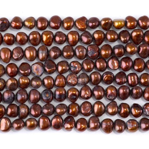This is a Dakota Stones 5-7mm Special Price Freshwater Pearl Copper Gemstone strand with irregular beads in 15-16 inch strand.