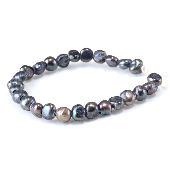 This is a Dakota Stones 6-10mm Freshwater Pearl Grey Peacock Button Gemstone strand with irregular beads in 8 inch strand.