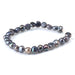 This is a Dakota Stones 6-10mm Freshwater Pearl Grey Peacock Button Gemstone strand with irregular beads in 8 inch strand.