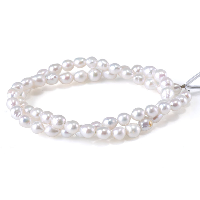 This is a Dakota Stones 6-7mm Freshwater Pearl White Potato Gemstone strand of round beads in 15-16 inch strand.