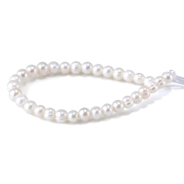 This is a Dakota Stones 6-7mm Freshwater Pearl White Potato Large Gemstone strand of round beads in 8 inch strand.