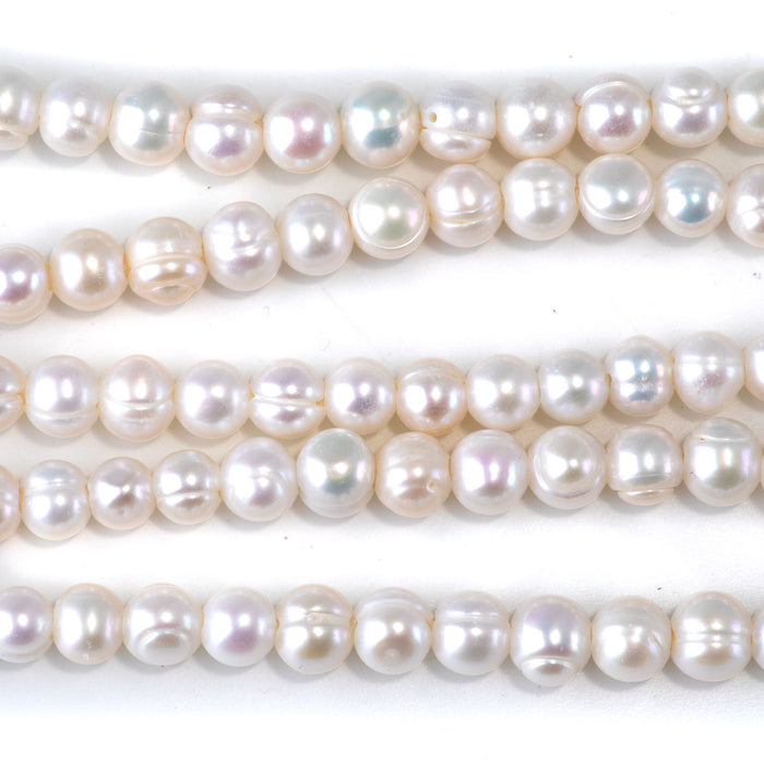 This is a Dakota Stones 6-7mm Freshwater Pearl White Potato Large Gemstone strand of round beads in 8 inch strand.
