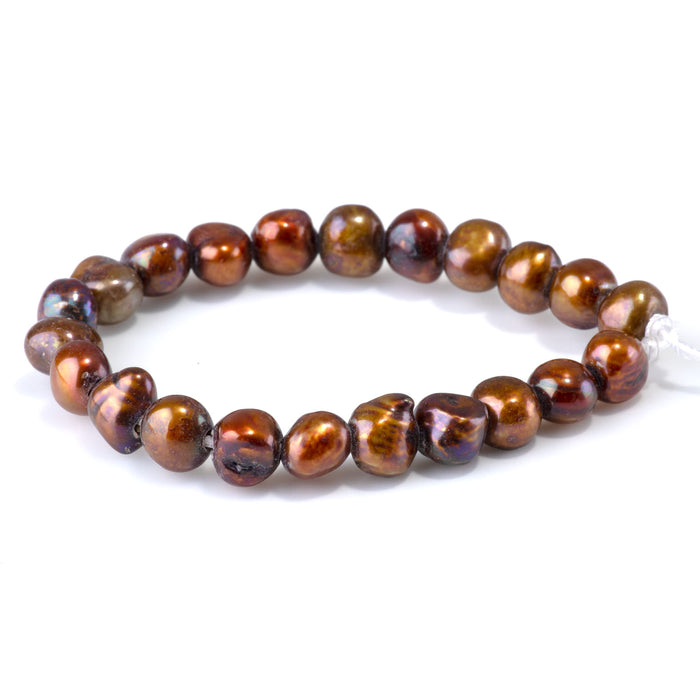 This is a Dakota Stones 7-12mm Freshwater Pearl Golden Brown Button Gemstone strand with irregular beads in 8 inch strand.
