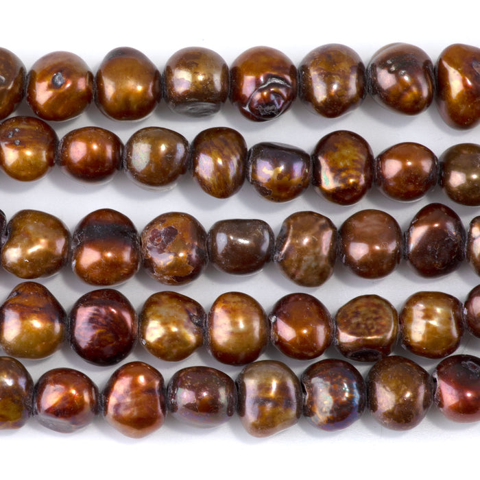 This is a Dakota Stones 7-12mm Freshwater Pearl Golden Brown Button Gemstone strand with irregular beads in 8 inch strand.