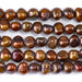 This is a Dakota Stones 7-12mm Freshwater Pearl Golden Brown Button Gemstone strand with irregular beads in 8 inch strand.